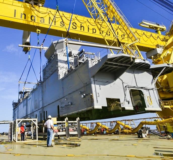 HUNTINGTON INGALLS INDUSTRIES LIFTS 700-TON DECKHOUSE ON TRIPOLI (LHA 7)